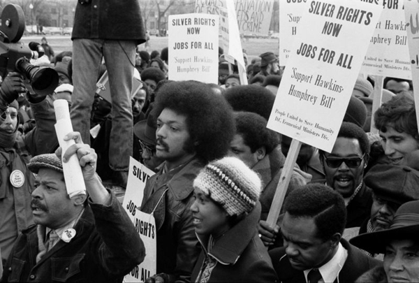 Jesse Jackson Jan 15th 1975 Jesse Jackson surrounded by marchers carrying