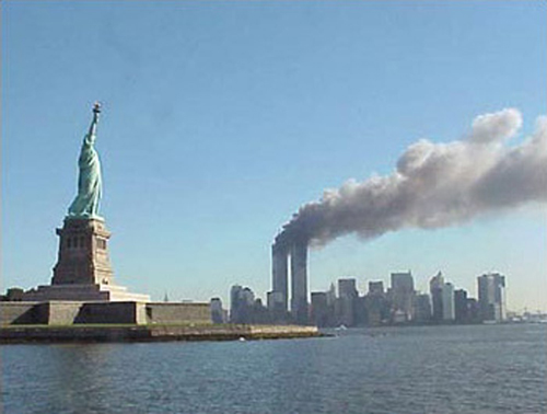 September 11, 2001 attacks in New York City: View of the World Trade Center and Statue of Liberty.